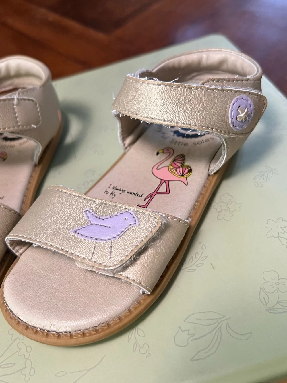 Livie & Luca Metallic Cream Sandals with Lilac Bird Detail